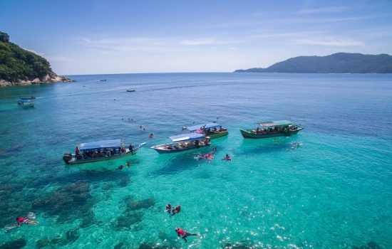 snorkelling-in-clear-waters-of-perhentian-island